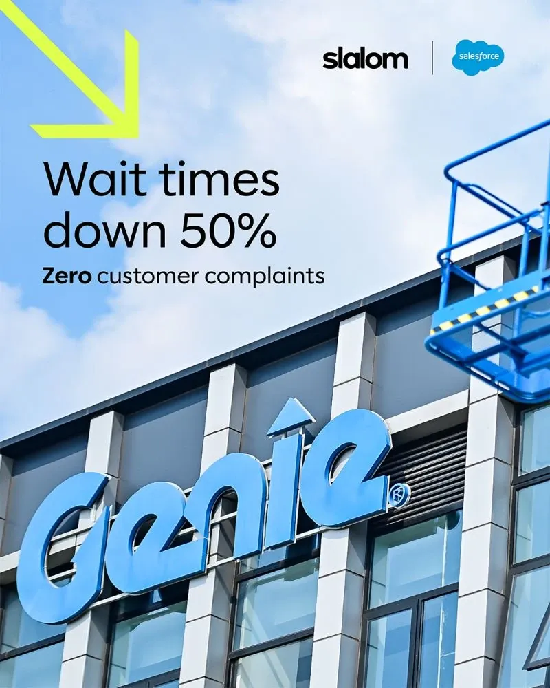 The blue Genie sign on the front of a building with a boom lift platform beside it, under the words: Wait times down 50%, zero customer complaints. Slalom and Salesforce logos sit at the top.